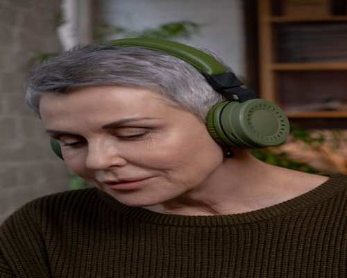 person enjoying a calm moment with headphones in a bright Mexican apartment
